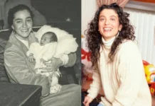 Enrica Cenzatti holding her baby in a heartwarming moment captured in black and white.