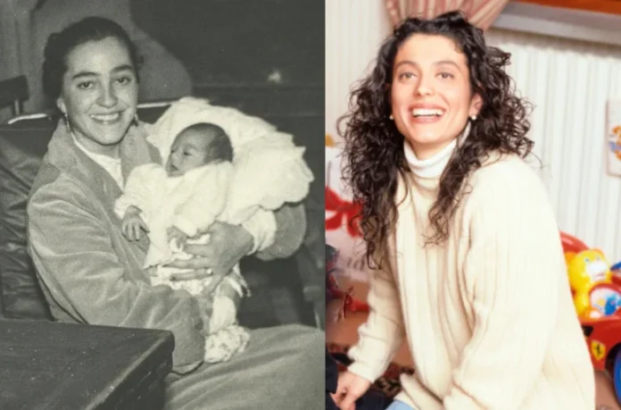 Enrica Cenzatti holding her baby in a heartwarming moment captured in black and white.