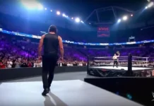 WWE SmackDown Episode 1488 arena with a packed crowd and wrestlers preparing in the ring.