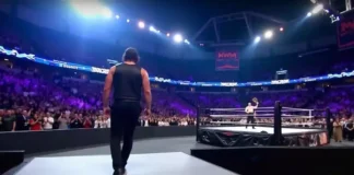 WWE SmackDown Episode 1488 arena with a packed crowd and wrestlers preparing in the ring.